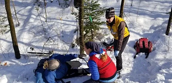 Patrol providing first aid in winter