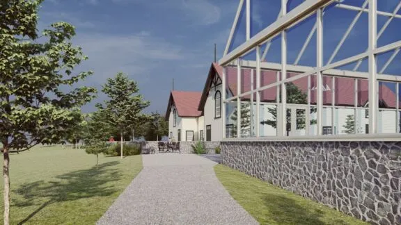 Vue de côté du futur bâtiment vitré adjacent au domaine de la ferme Moore