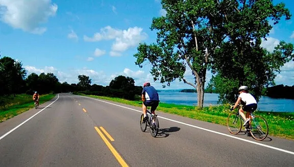 Cyclists on a car-free parkway closed to motor vehicles during Bikedays.