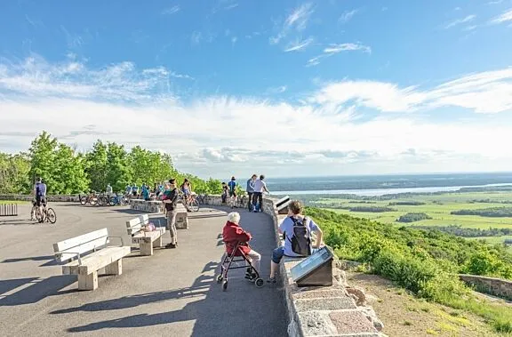 People looking at the view from the Champlain Lookout.