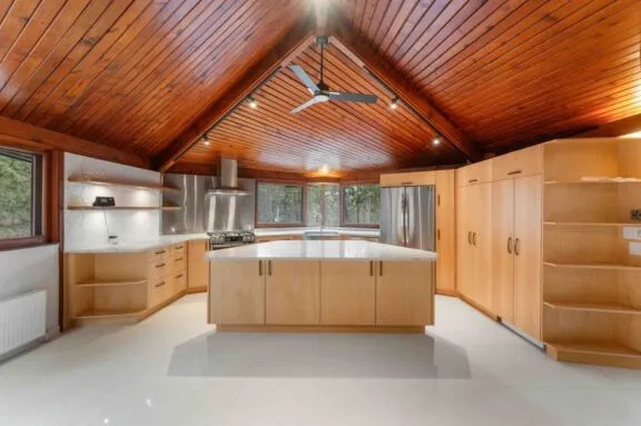 Kitchen area with kitchen island in the middle of the room.