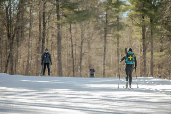 Volunteer patroller skiing in Gatineau Park