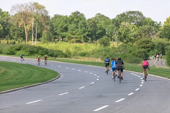 Cyclists on a car-free parkway closed to motor vehicles during Bikedays.