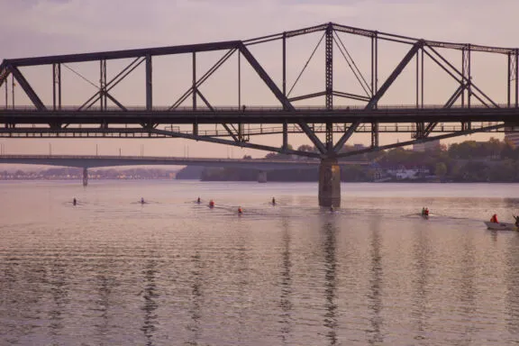 The Alexandra Bridge from the Ottawa River. In the background, the Macdonald-Cartier Bridge. Credit: NCC