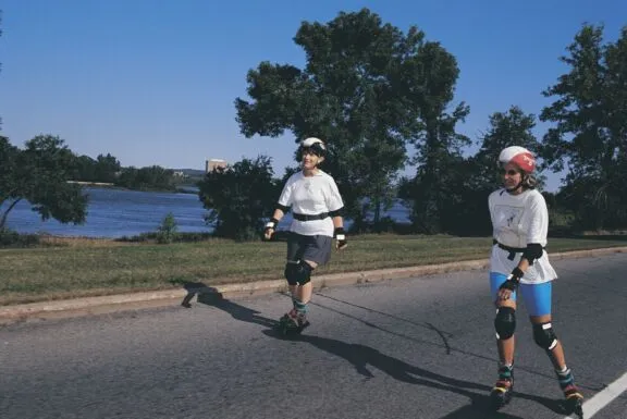 People in-line skating on a car-free parkway closed to motor vehicles during Bikedays.