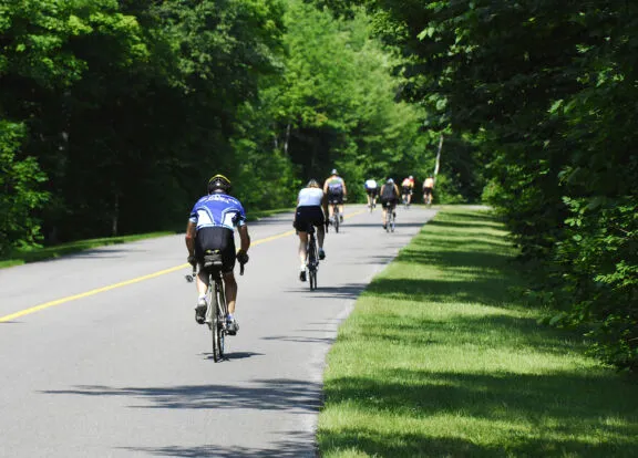Cyclists on a car-free parkway closed to motor vehicles during Bikedays.