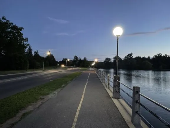 Lamppost with opal white globe on roadways and pathways along the Rideau Canal.