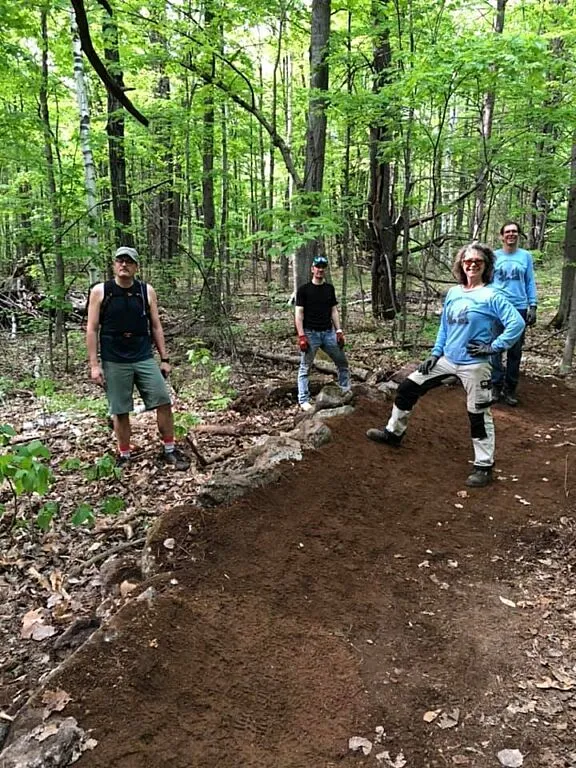 Volunteers at work in the Park (left to right: Hugo Richer, Alain Bellerive, Christine Galipeau and Marc Brulé).