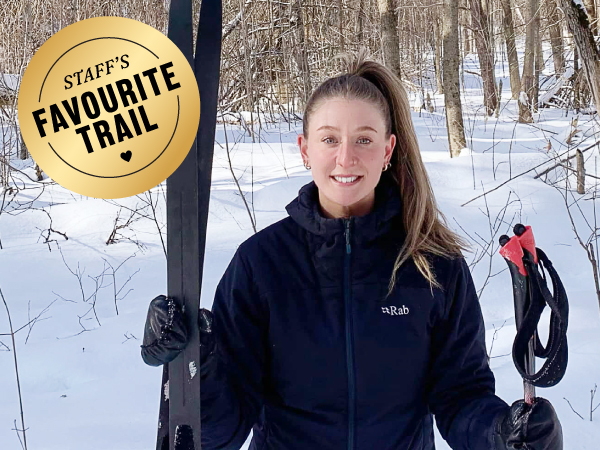 Person holding cross-country skis