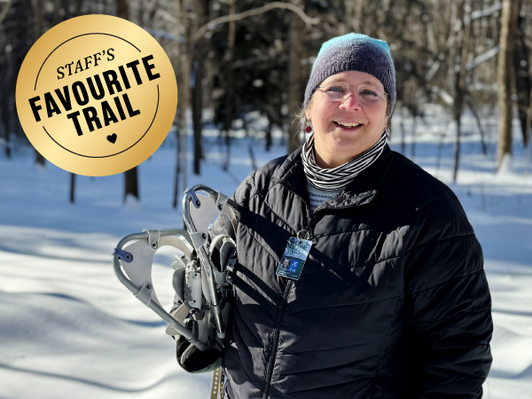 Person holding snowshoes