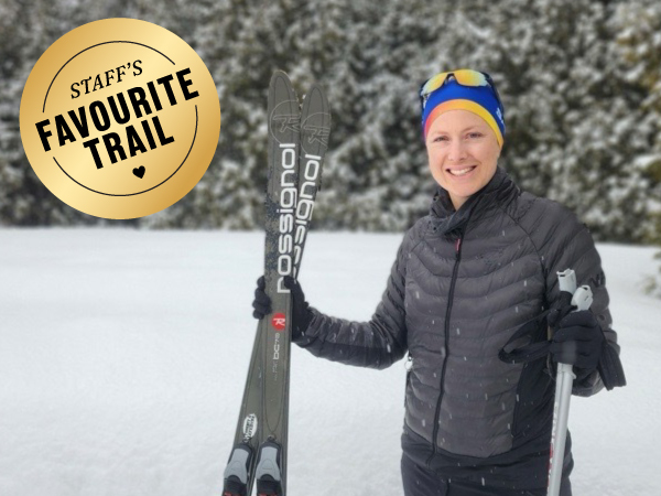 Person holding cross-country skis