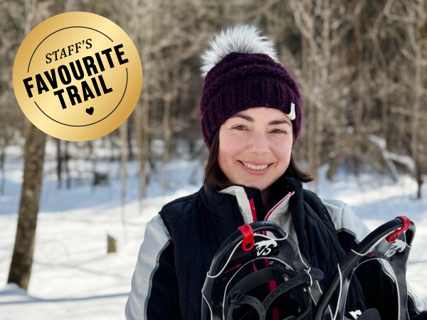 Person holding snowshoes