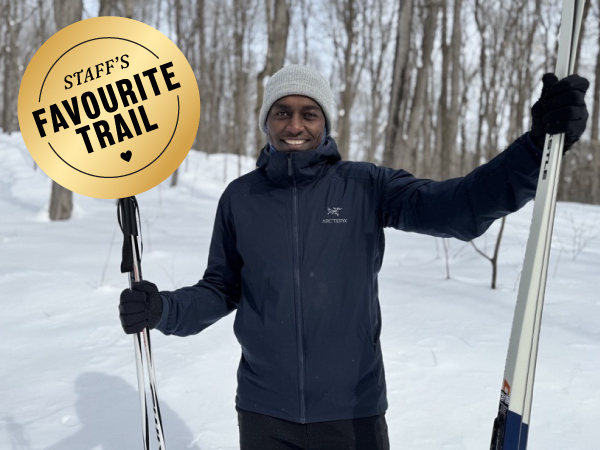 Person holding cross-country skis