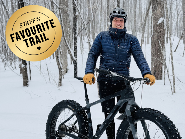 A person holding a bicycle