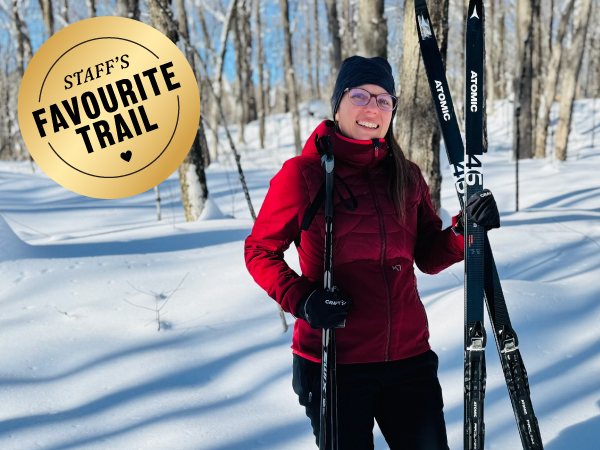 Person holding cross-country skis