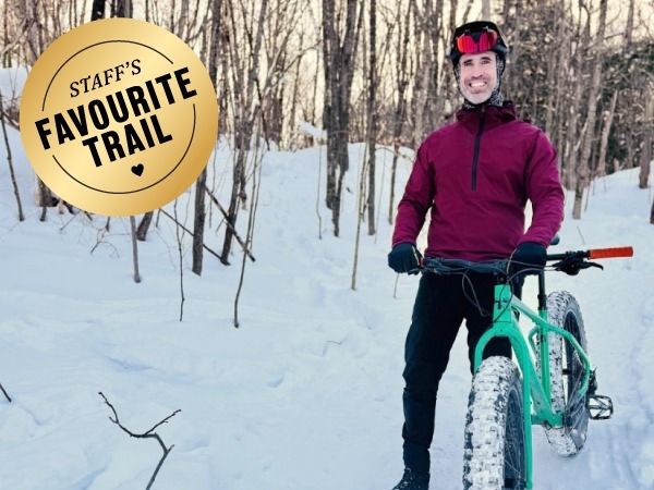 A person holding a bicycle